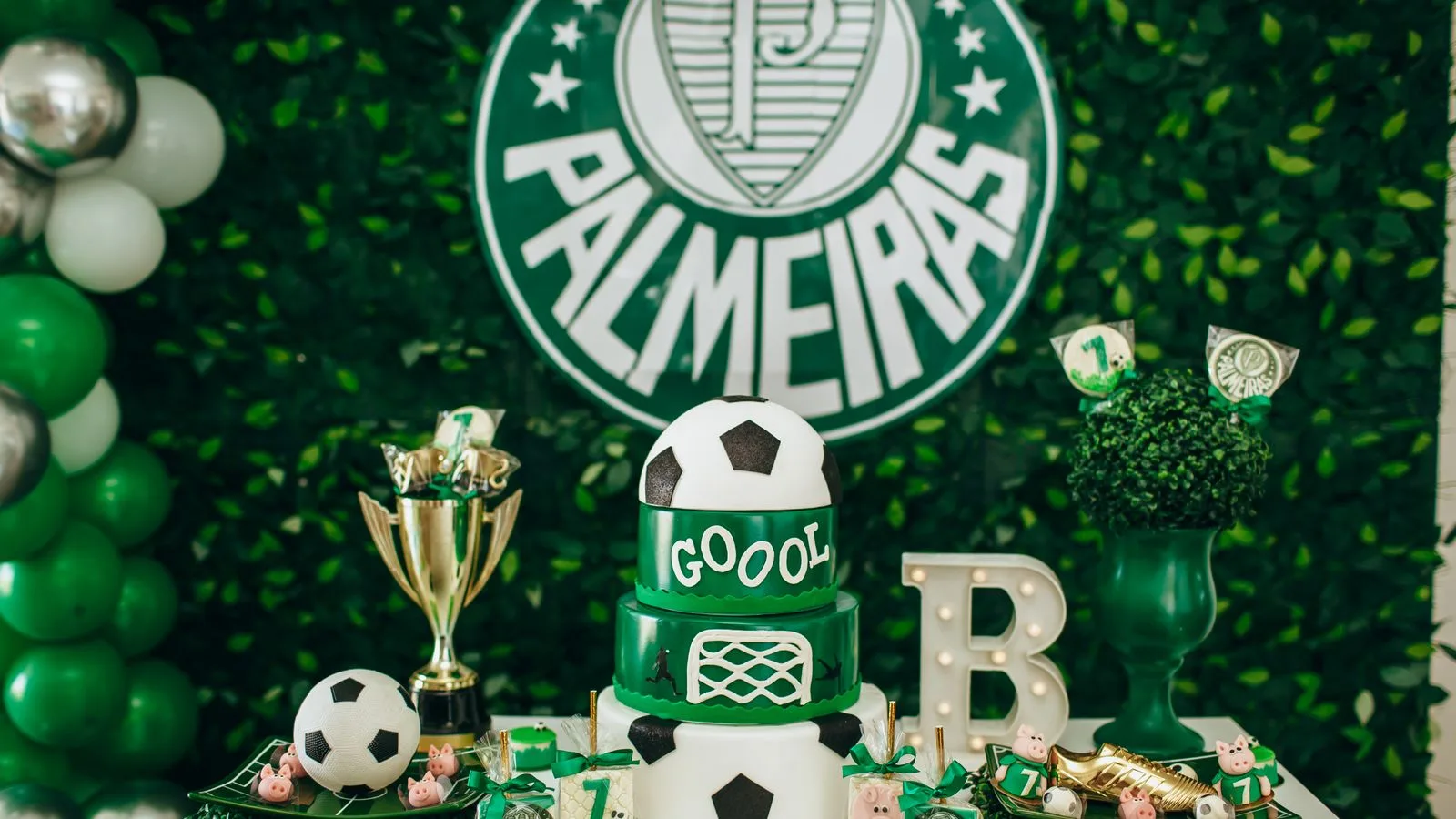 Bright and festive soccer-themed birthday party with decorations, cake, and Palmeiras logo.