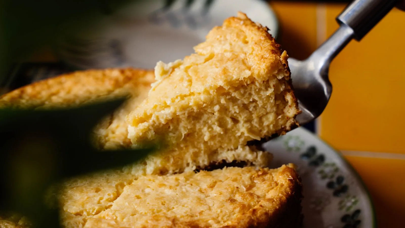 Close-up of a tasty homemade pineapple cake being served, perfect for desserts and gatherings.