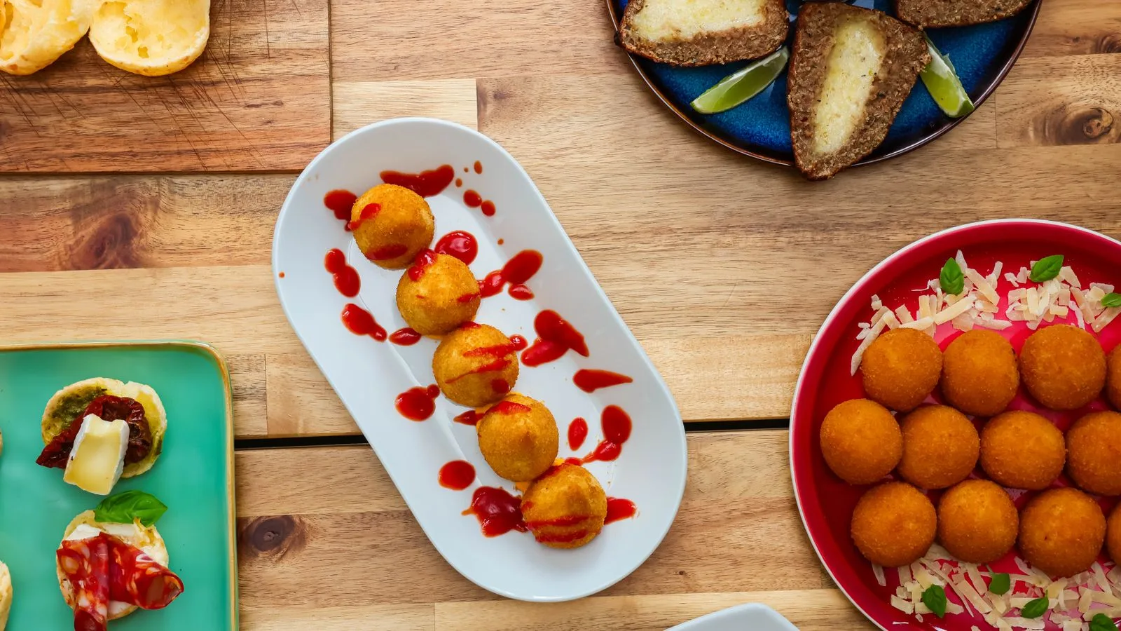 A vibrant collection of Brazilian culinary dishes elegantly presented on a wooden table.