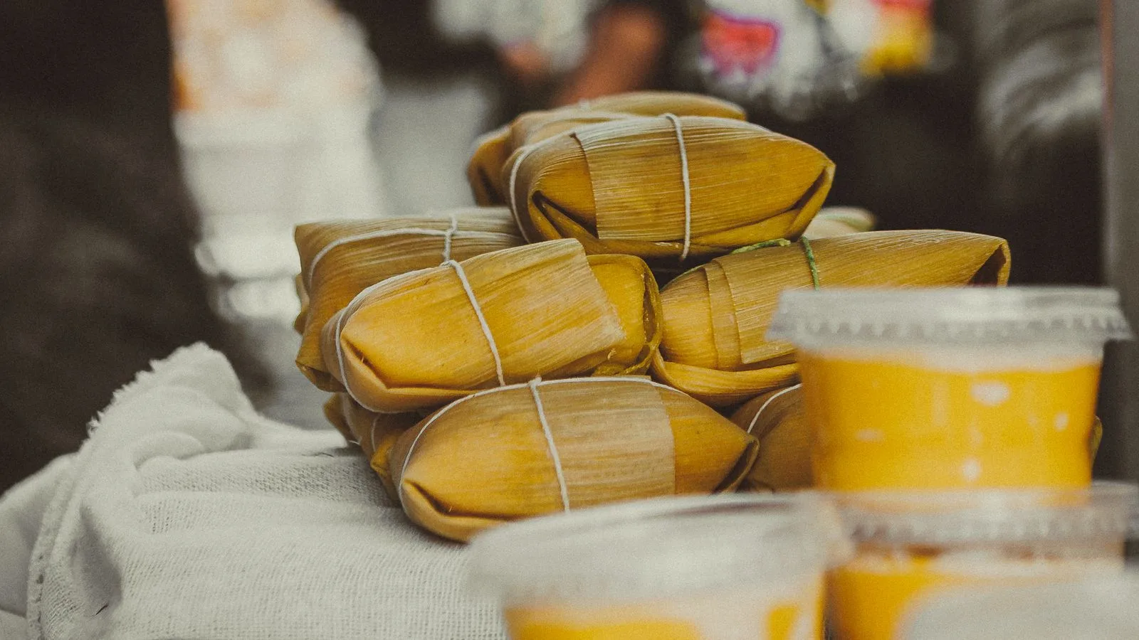 Close-up of delicious pamonha bundles at a São Paulo food stall. Perfect for culinary enthusiasts.