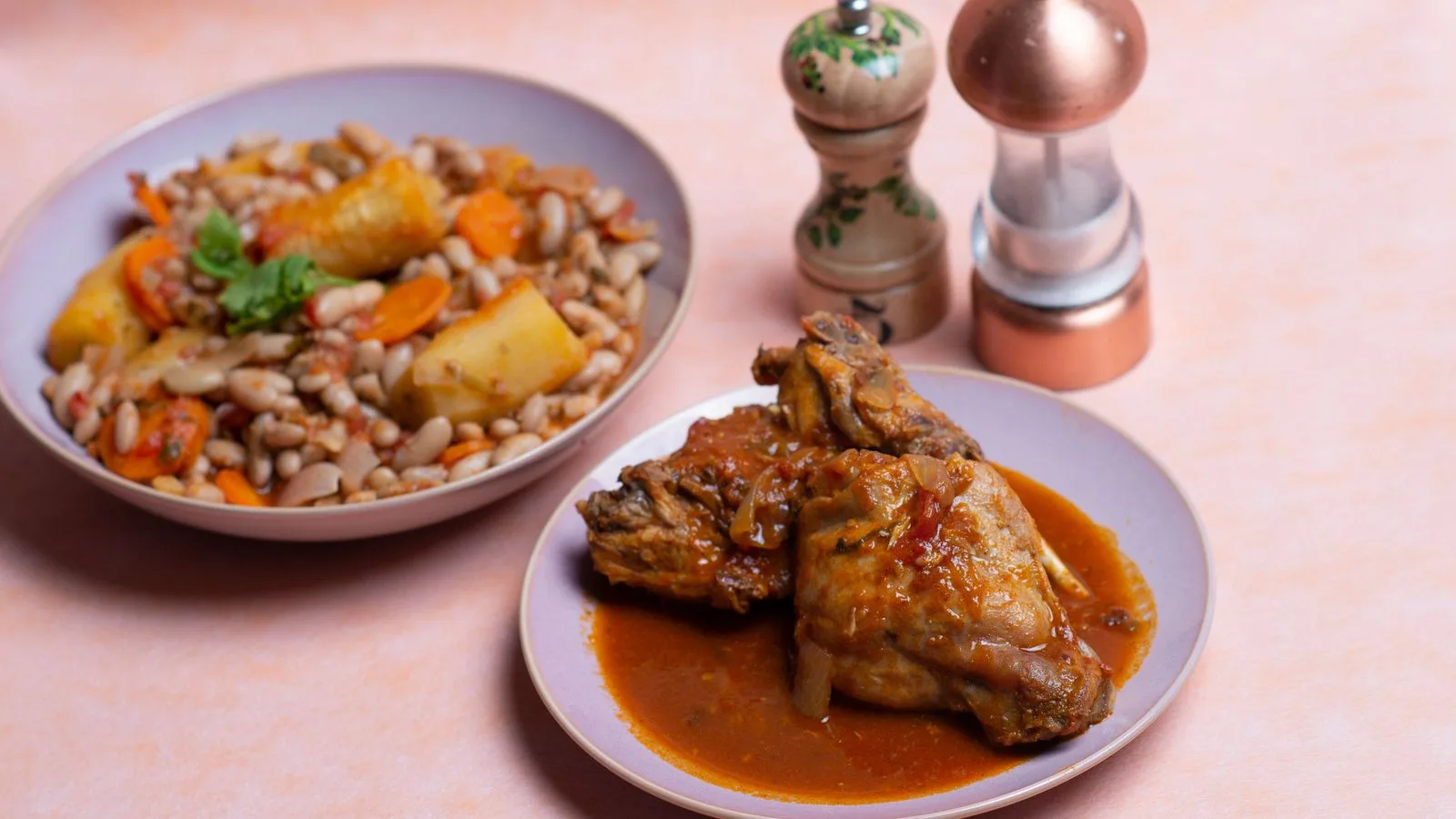 Flavorful African-style chicken stew with beans, carrots, and potatoes, perfect for culinary inspiration.