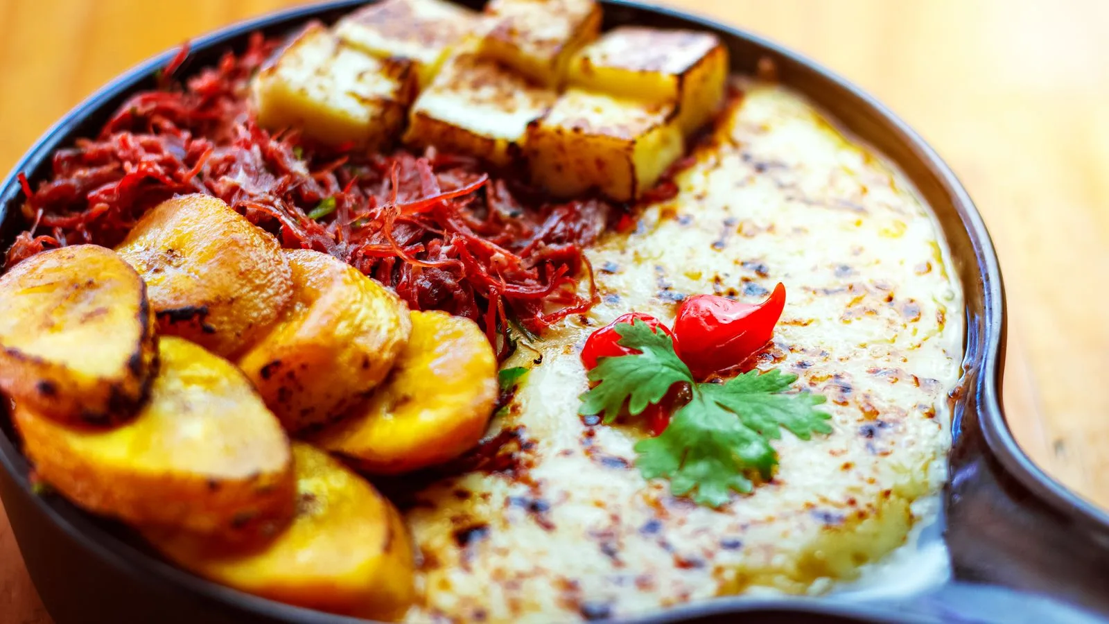 Savor a hearty meal with fried plantains, cheese, and grilled vegetables. Perfect for a vibrant lunch.