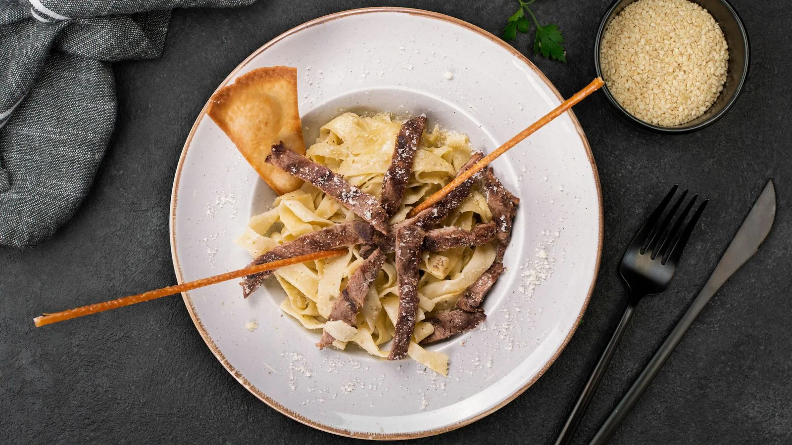 Plate of beef stroganoff with fettuccine pasta, perfect for gourmet dining.