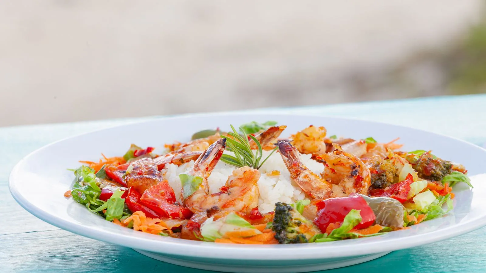 A vibrant shrimp and vegetable dish with rice, perfect for foodies.