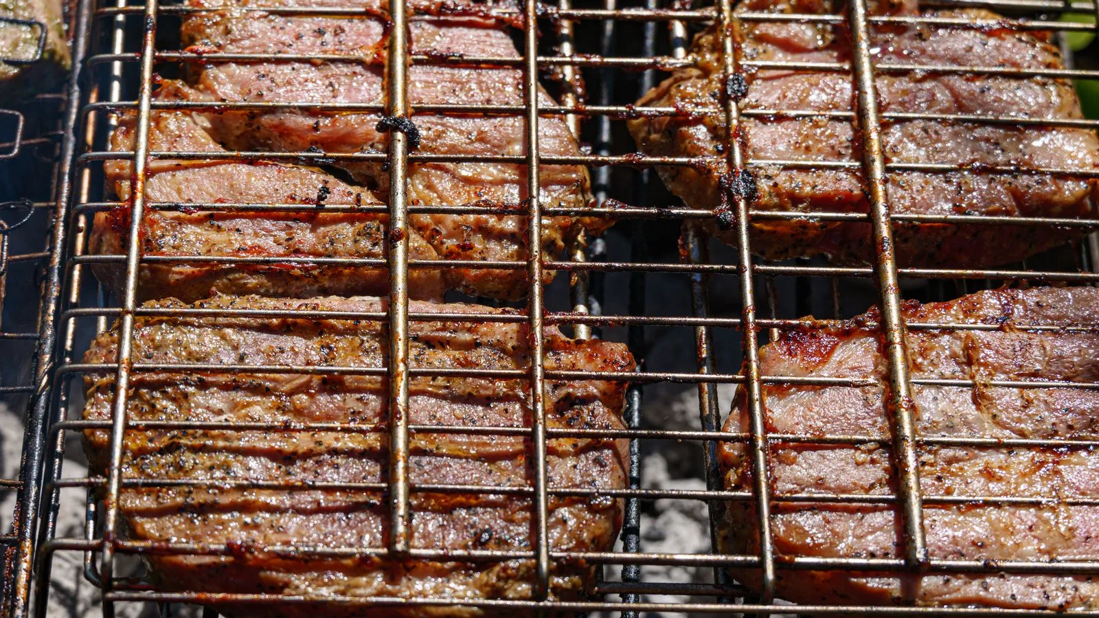 Juicy grilled beef steaks sizzling on a barbecue in Coesfeld, Germany.